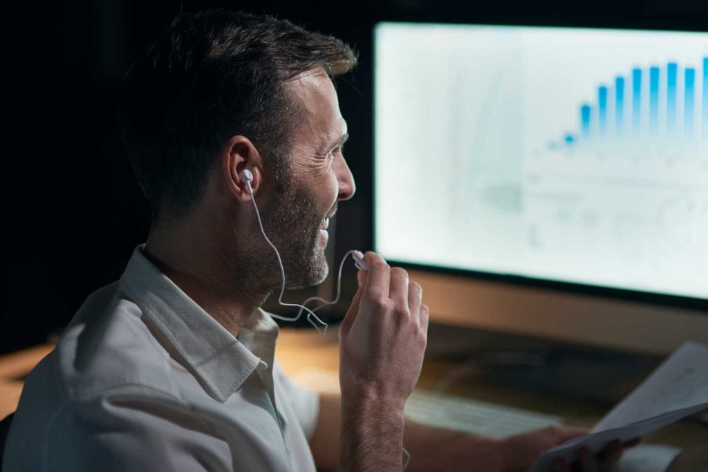 side view man listening music his office
